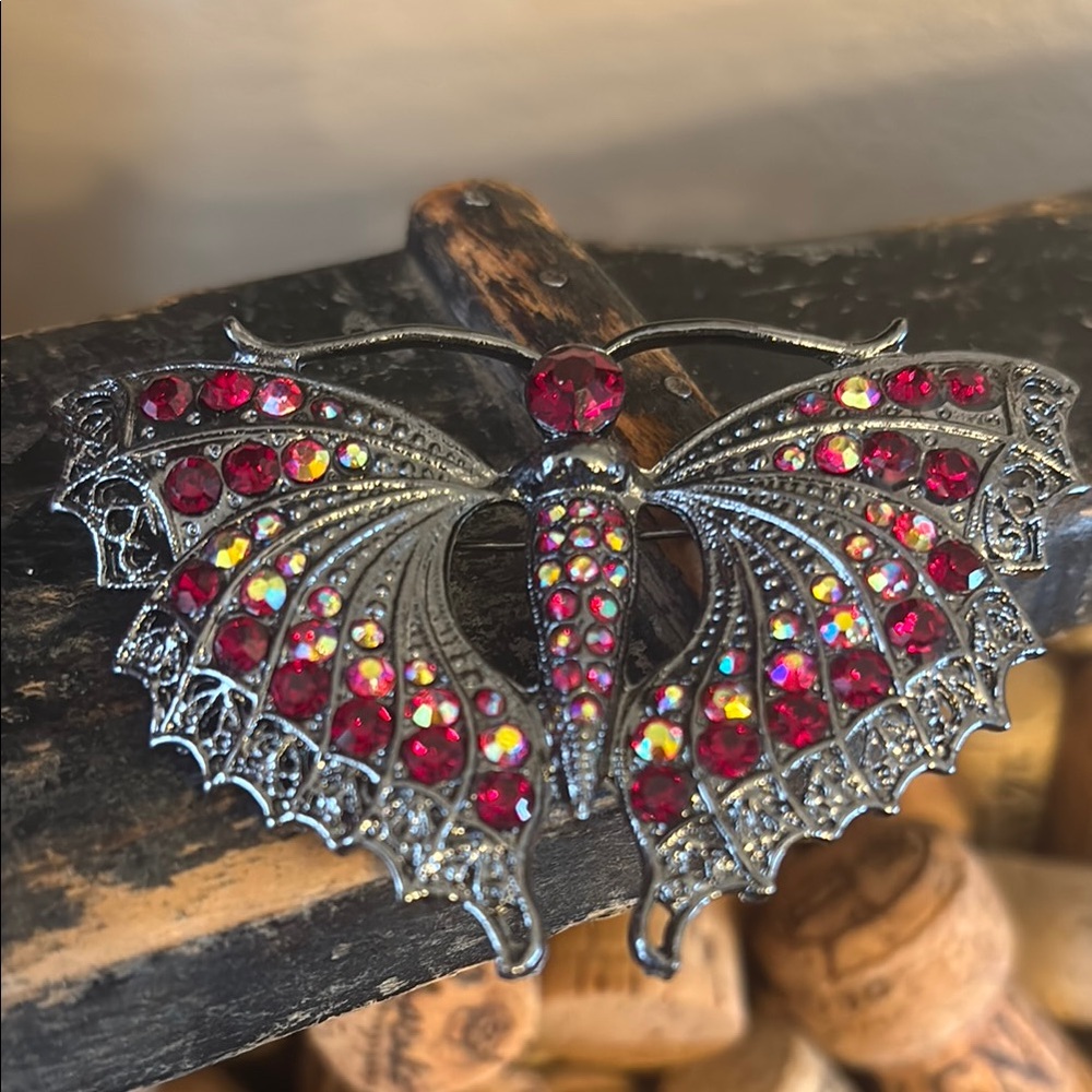 Red Gemstone Butterfly Brooch set in a gunmetal/silver setting - Picture 1 of 4